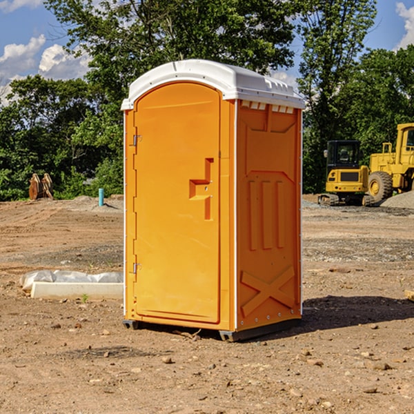 what is the cost difference between standard and deluxe portable toilet rentals in Dunn County